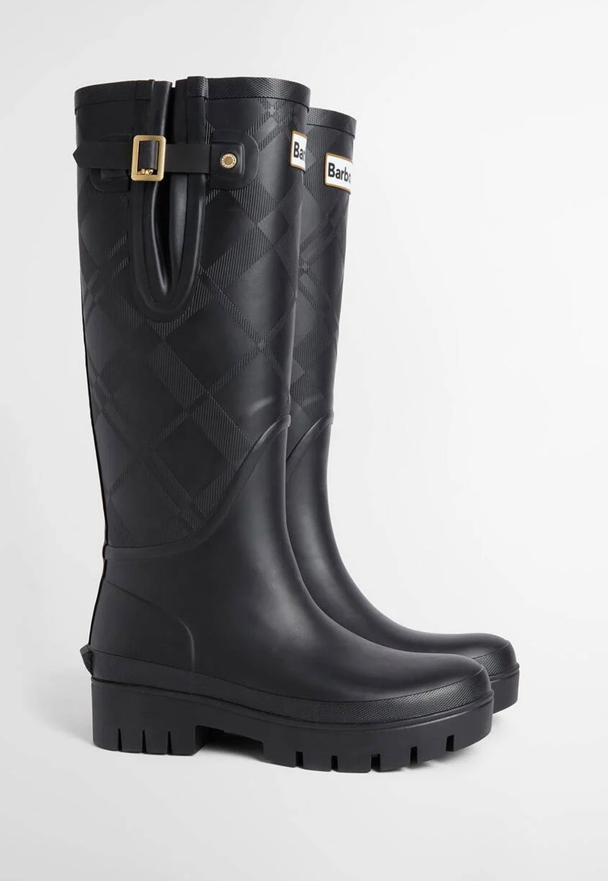Side profile of Barbour Leighton Tartan Wellingtons showing the adjustable gusset, tall silhouette and chunky rubber sole.