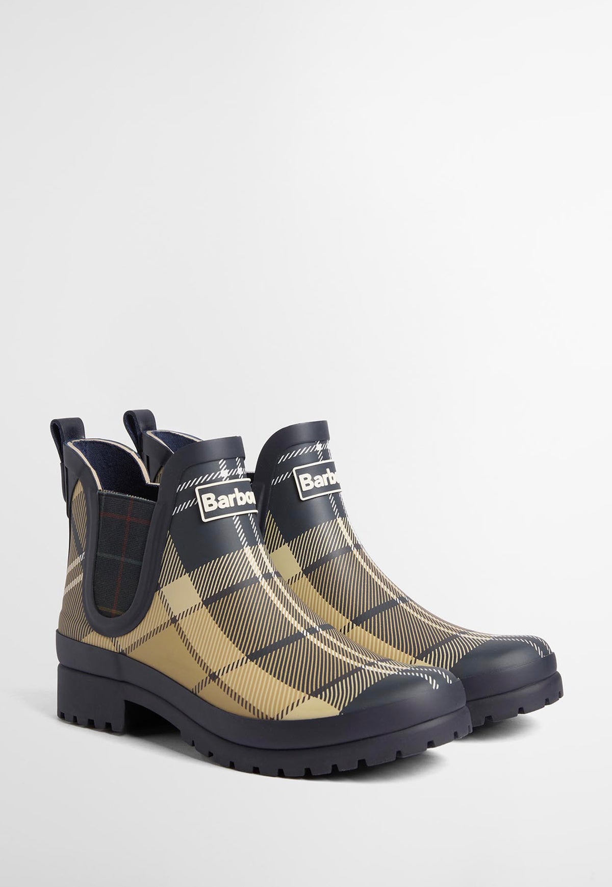 Side front profile of Barbour Mallow Chelsea Wellingtons showing the elasticated side gusset and streamlined rubber construction and Barbour logo.