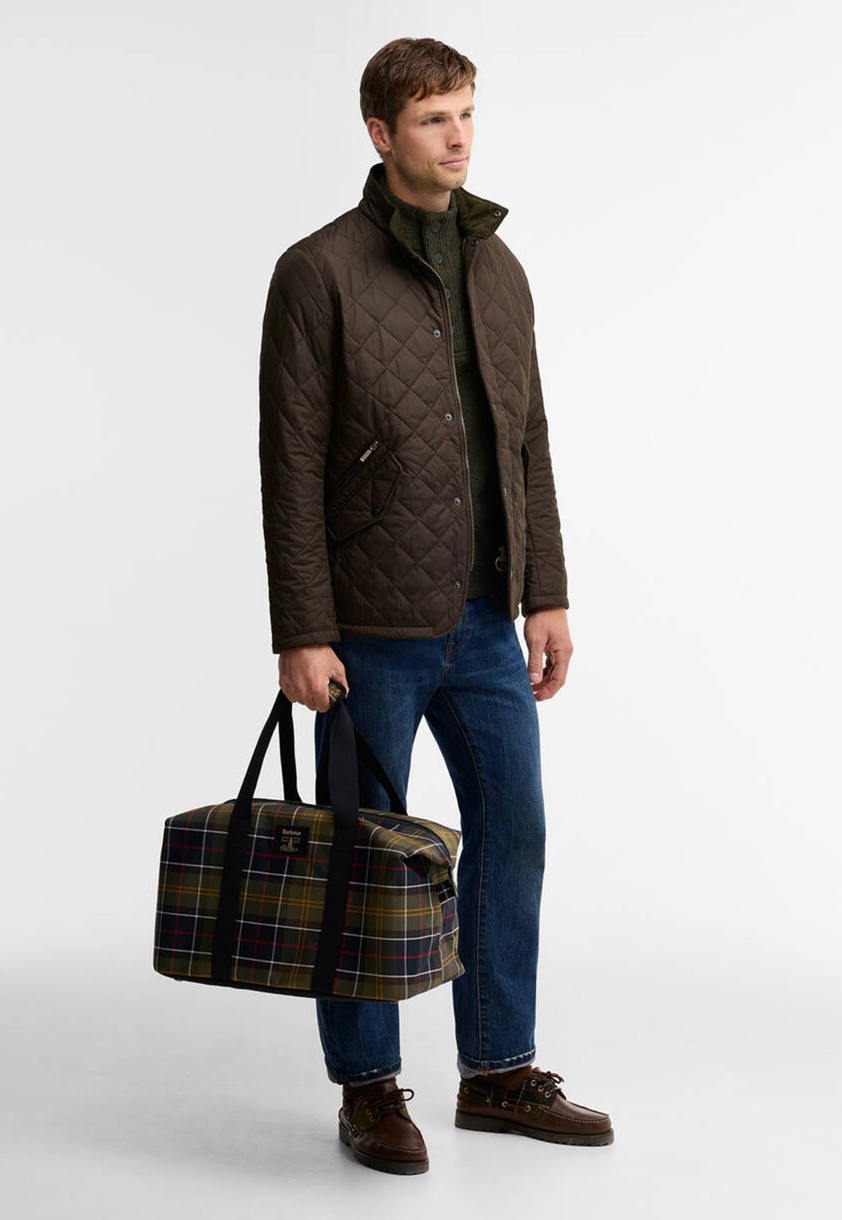 Barbour Torridon Tartan Carry All Bag carried as an everyday tote, showing its spacious design and signature tartan finish.
