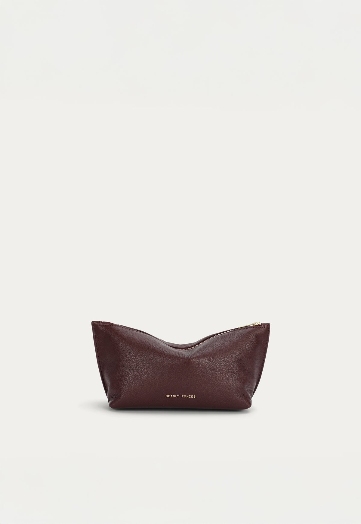 The Deadly Ponies Medium Poucher in Dark Cherry is crafted from soft calf nappa leather.