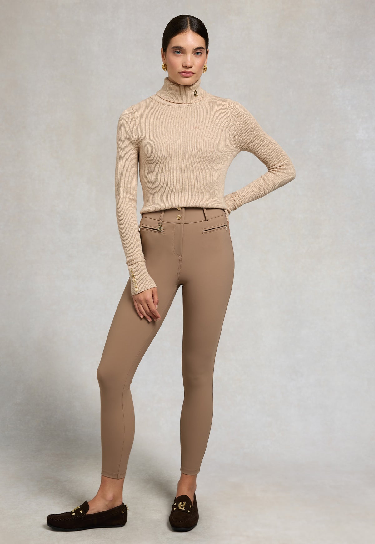 Holland Cooper Contour Trouser in Mocha, featuring a high waist, slim tailored silhouette, gold HC hardware and zipped front pockets.