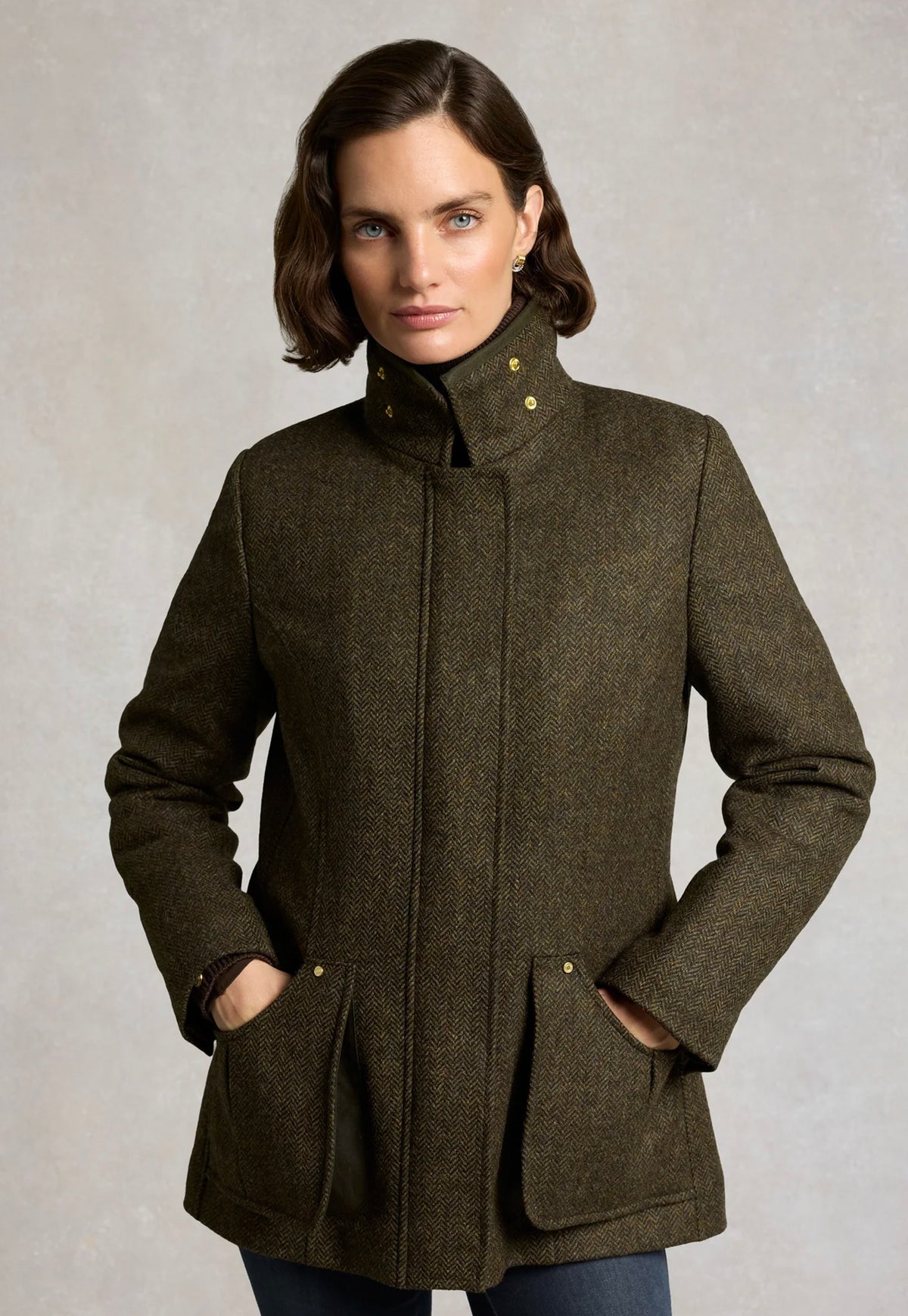Holland Cooper Country Classic Jacket in Dark Green Herringbone, featuring a British Millerain waxed collar, diamond-quilted lining and storm flap fastening.