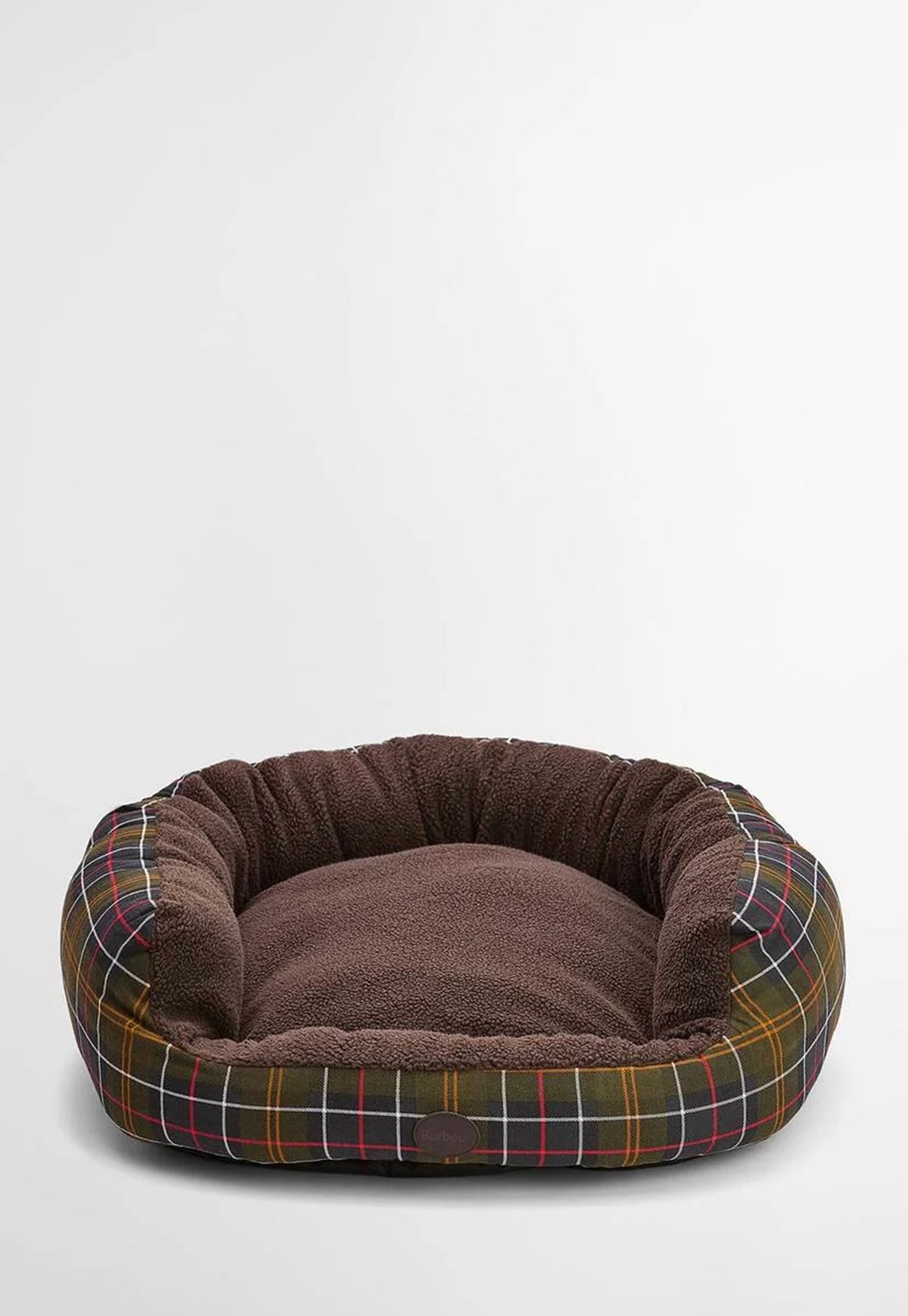 The Barbour Snuggle Dog Bed 30" featuring a lowered front, soft fleece lining, tartan trim and embossed Barbour badge.