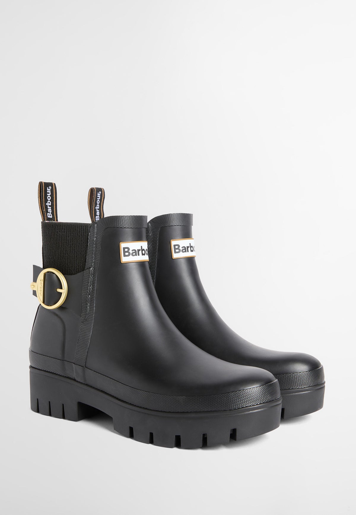 Side front profile of Barbour Hepburn Ankle Wellingtons showing ribbed elastic side panels, chunky rubber sole and Chelsea boot silhouette.