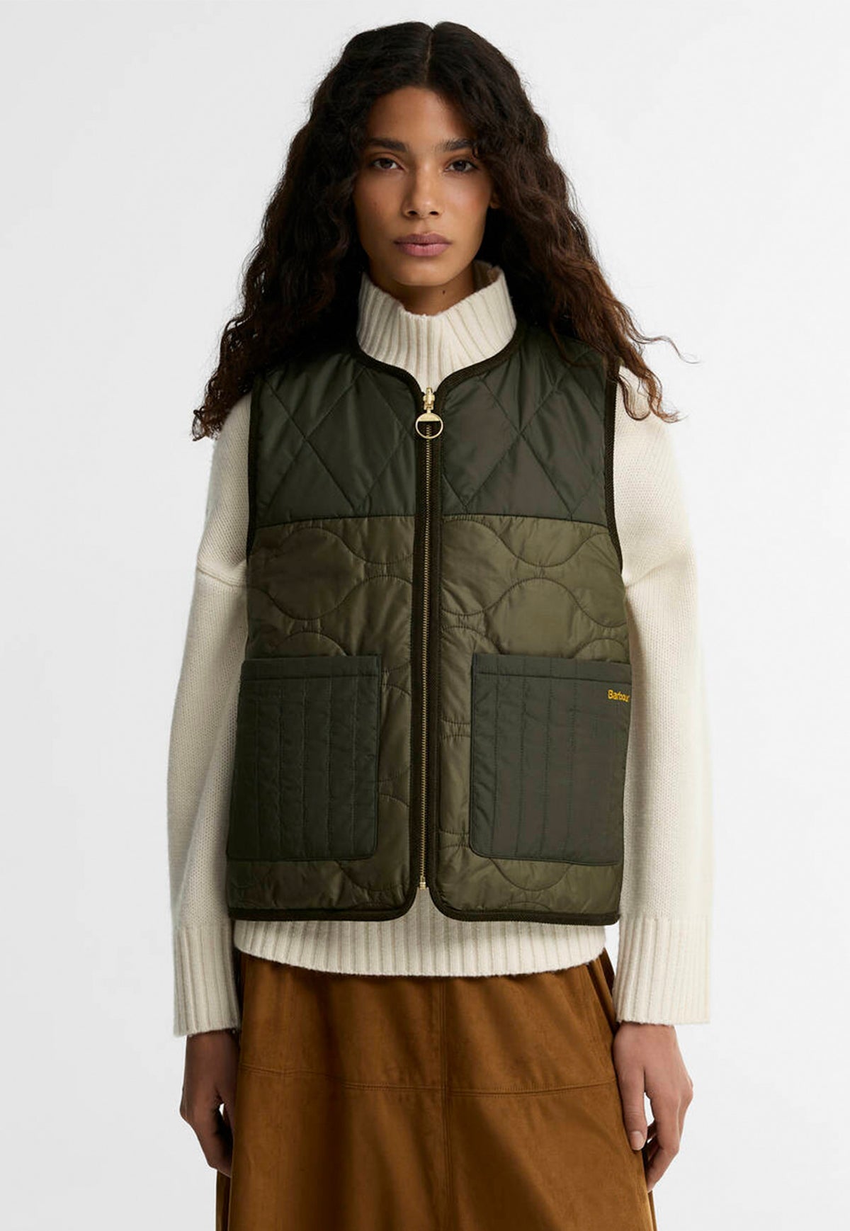 Barbour Nunwell Reversible Quilted Liner featuring lightweight quilting, front patch pockets and metal zip fastening.