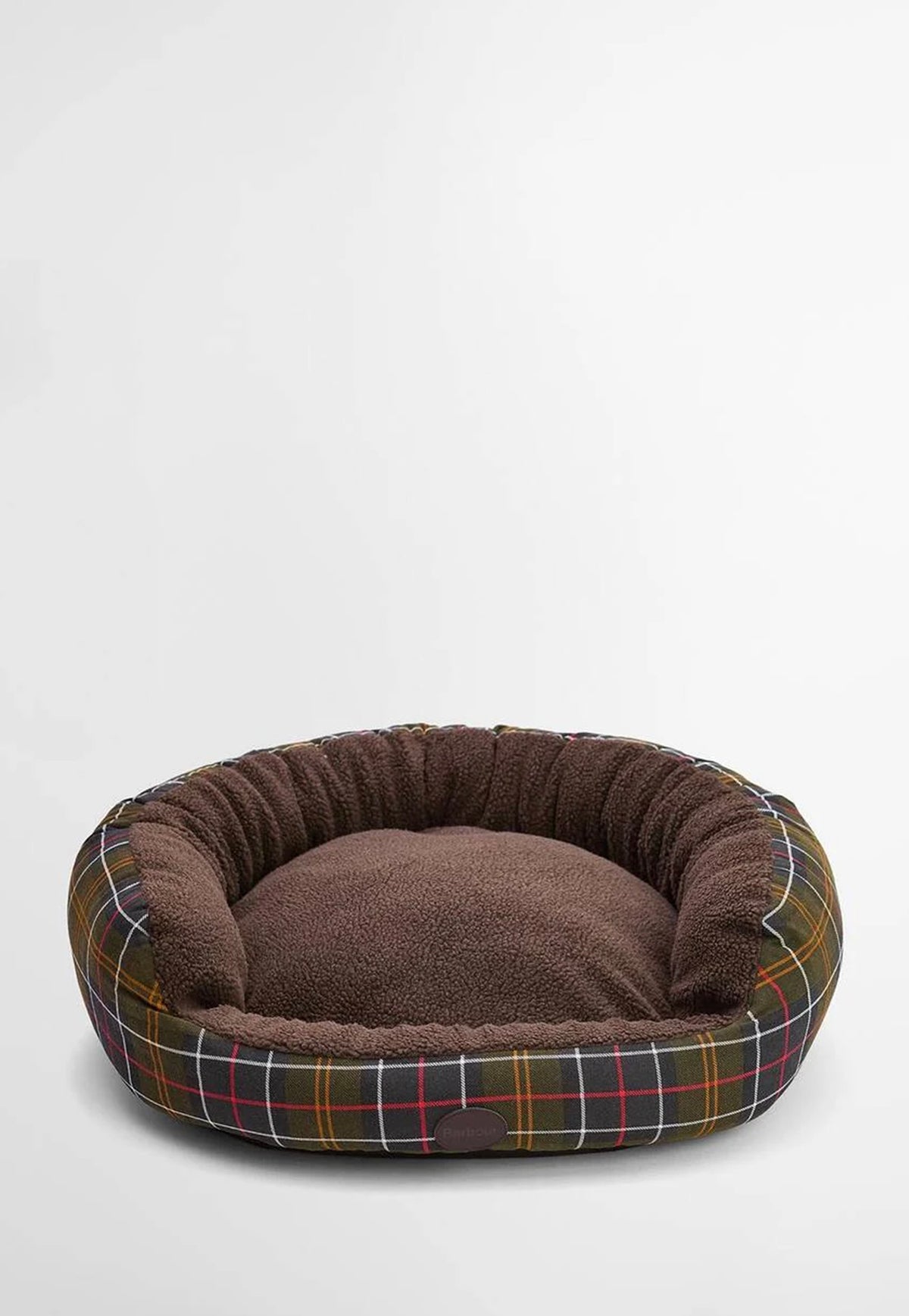 Barbour Snuggle Dog Bed 35" featuring a lowered front, soft fleece lining, tartan trim and embossed Barbour badge.