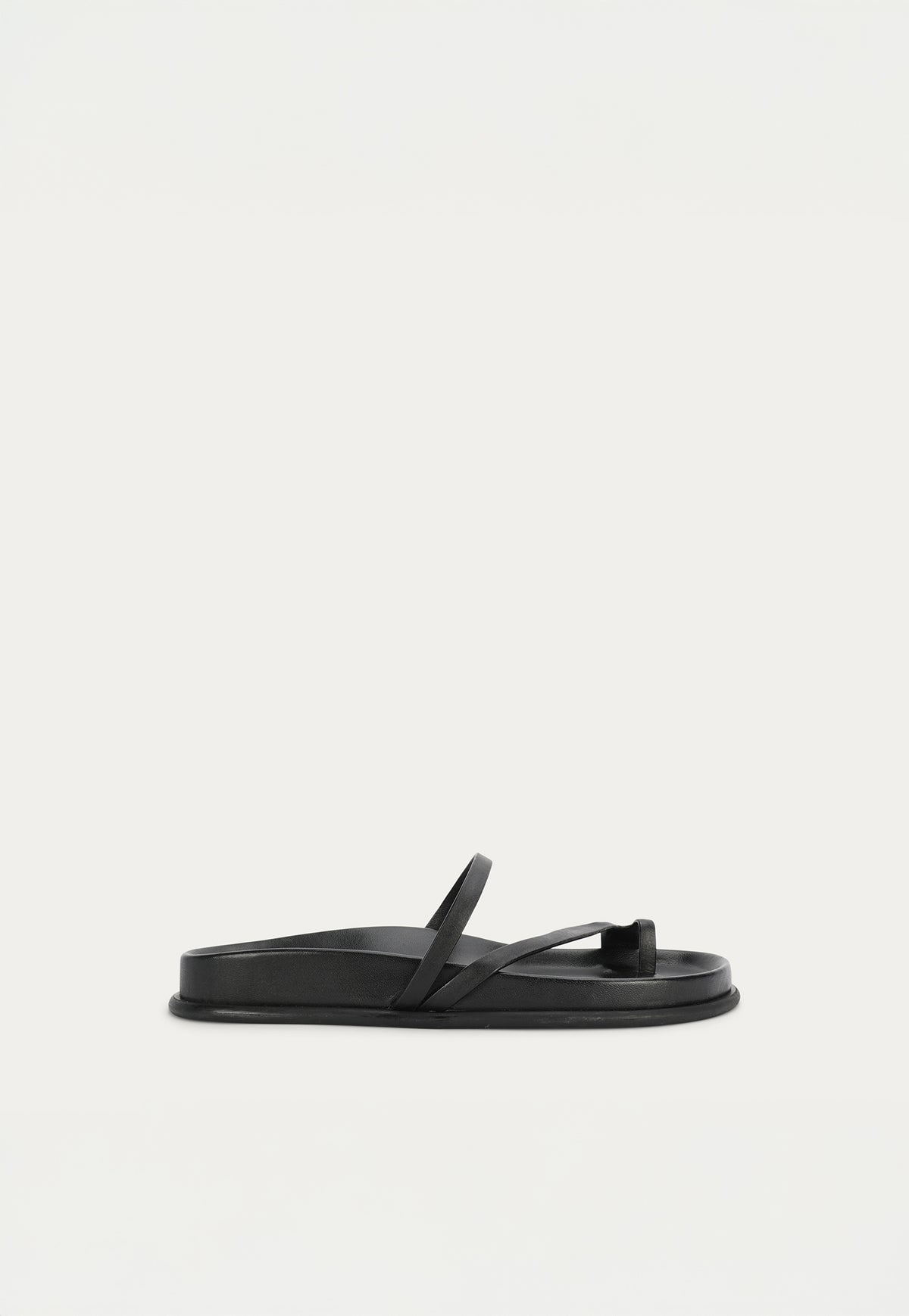 The Deadly Ponies Ariadne Slide in Black is crafted from premium calf nappa leather with a soft lamb leather-covered footbed.