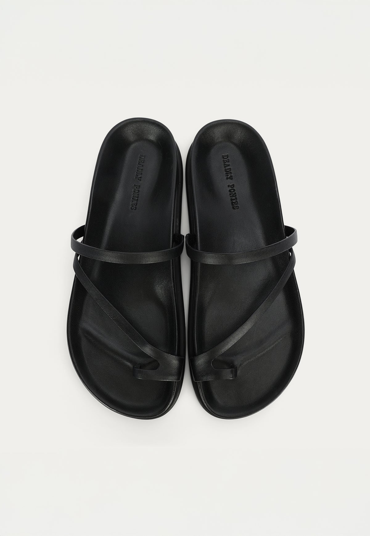 Top view of the Deadly Ponies Ariadne Slide in Black, crafted from premium calf nappa leather with a soft lamb leather-covered footbed.