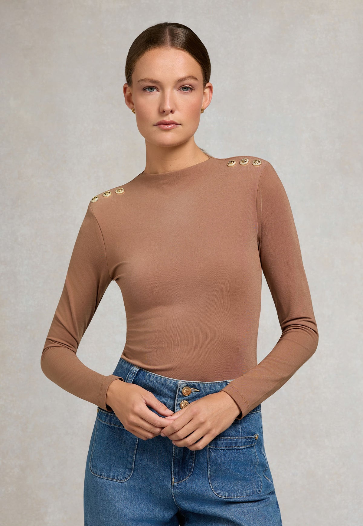 Holland Cooper Harper Long Sleeve Top in Toffee, featuring a slim-fitting silhouette, long sleeves and signature crested HC rivets at the shoulders.