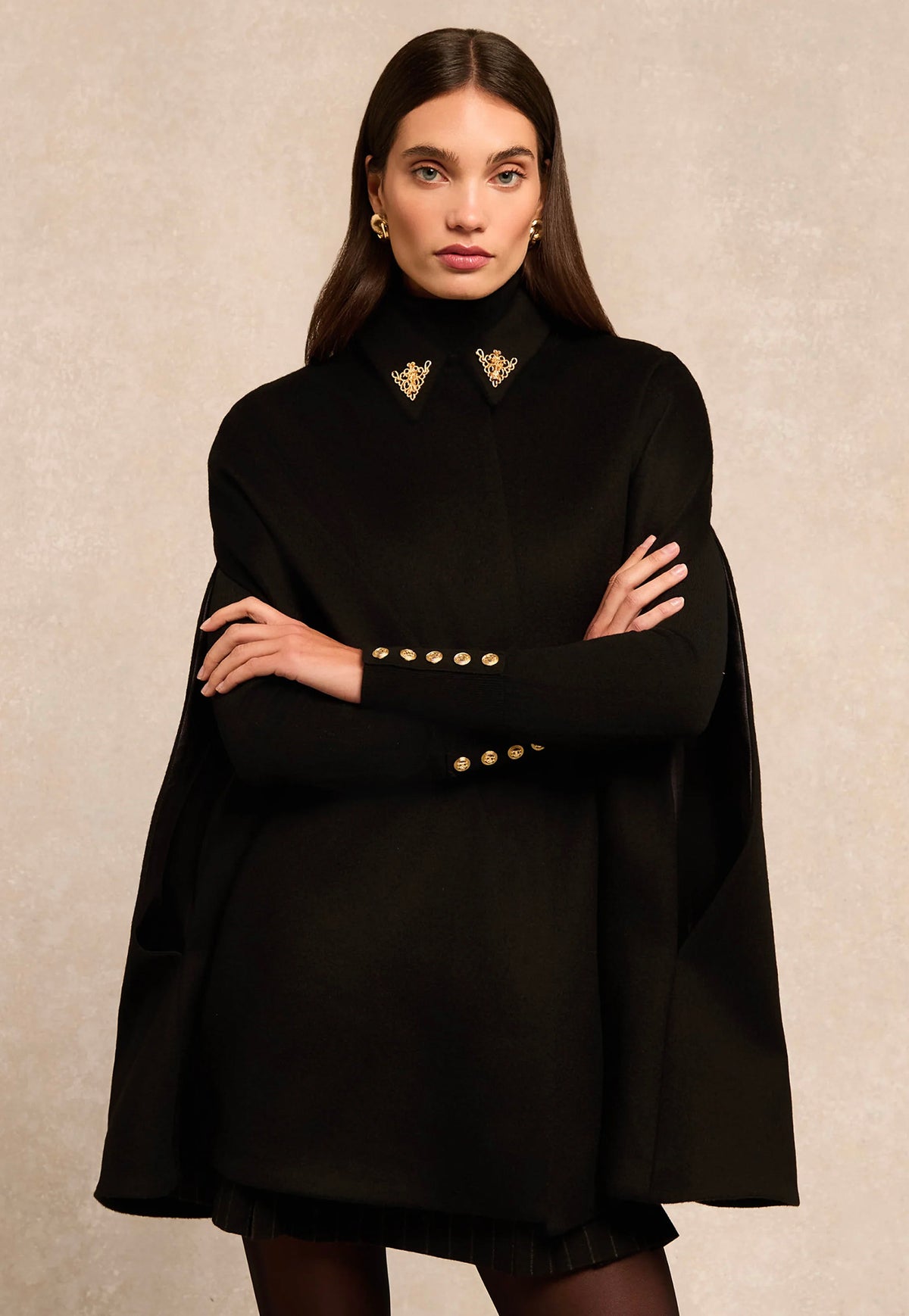 Holland Cooper Knightsbridge Cape in Soft Black, featuring a tailored shoulder fit, gold HC collar hardware and signature embroidered back detailing.