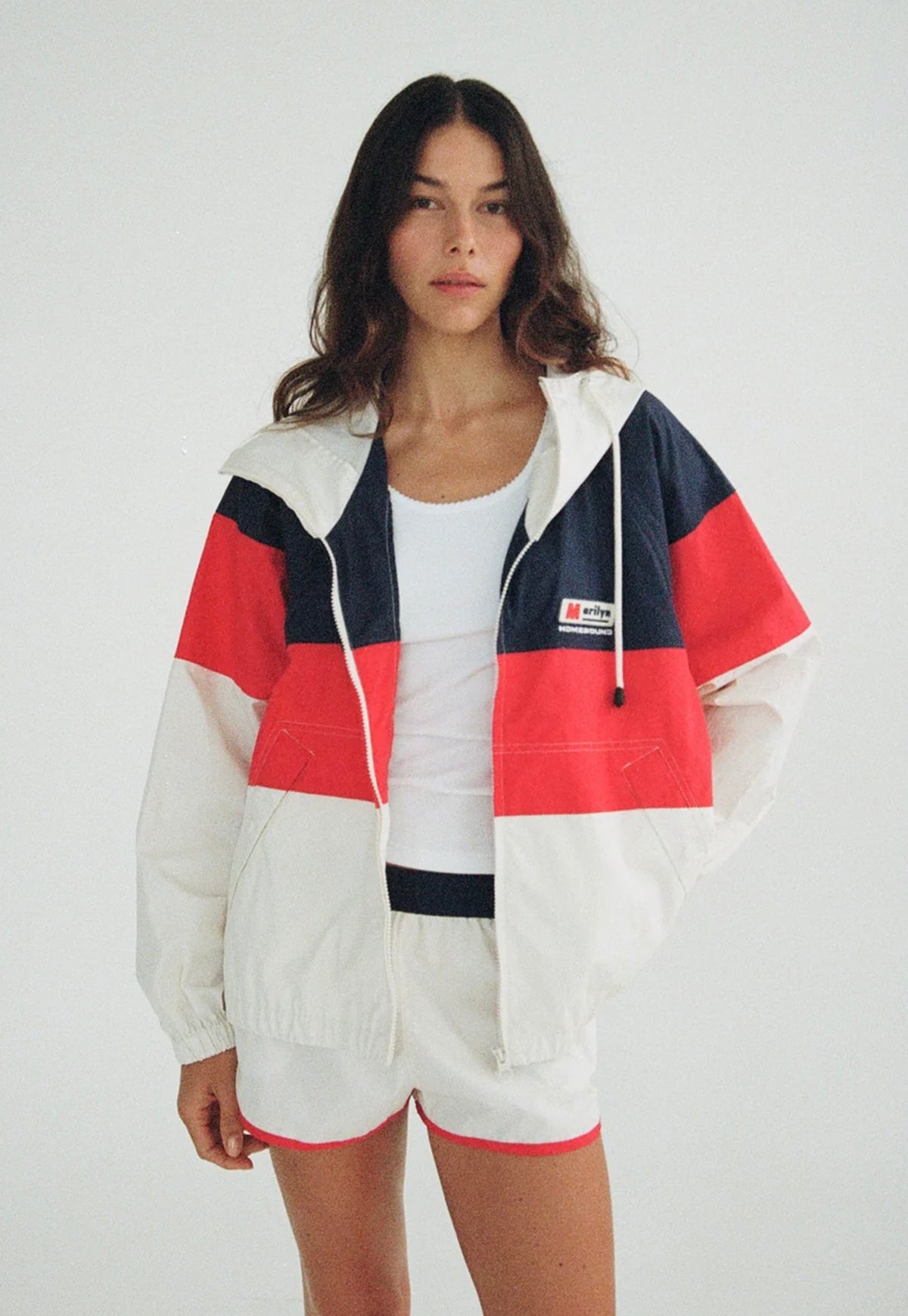 Maggie Marilyn Homebound Windbreaker in Nautical, navy, red and ivory colour-blocked cotton jacket with drawstring hood and zip closure.
